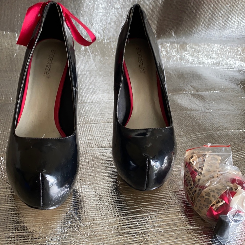 Black high heel pumps.